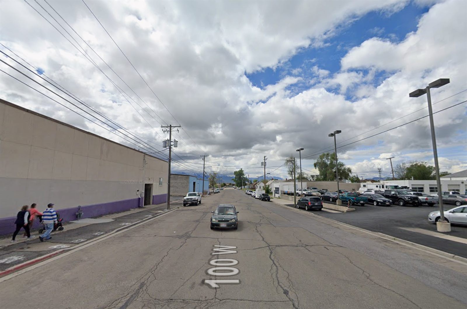 100 West today: a wide, empty street of parking lots and blank walls