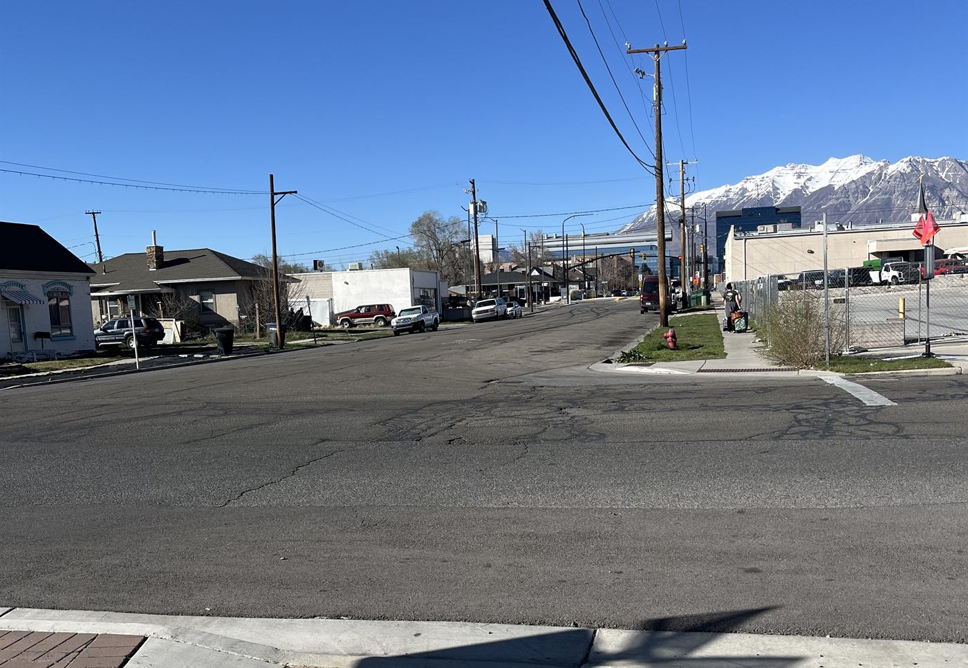 100 West today at the same corner: a wide, open stretch of asphalt